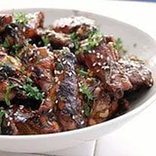 a white bowl filled with meat