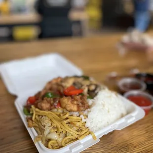 a take out container of food on a table