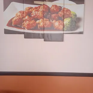 The beautiful picture on the wall Orange Chicken. Ambience. Stay &amp; eat inside...