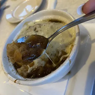 French onion soup. Perfectly prepared perfect cheesy topping.