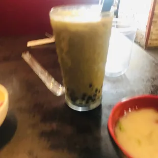 a glass of milk and a bowl of soup