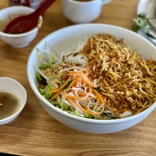 a bowl of noodles and sauces