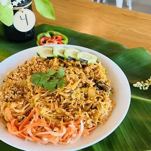 a plate of food on a banana leaf