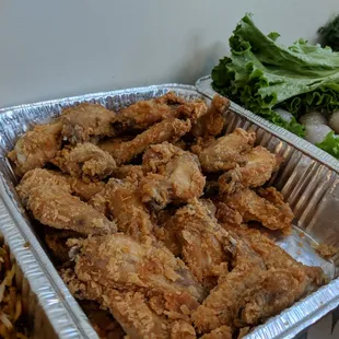 a variety of food in aluminum containers