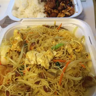 Bottom: Singapore noodles.  Top: Kung Pao chicken combo (comes with egg roll and cream cheese wonton)