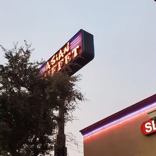 the neon sign for the restaurant