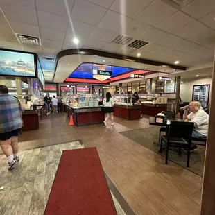people walking through the restaurant