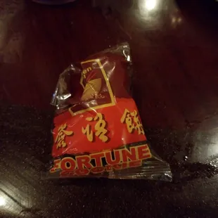 a bag of fortune candy on a table