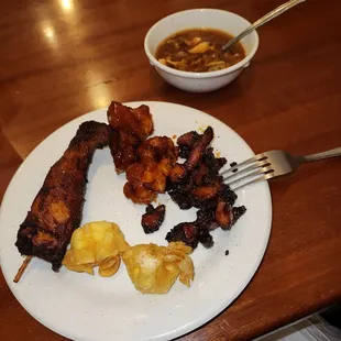 Teriyaki Chicken, General Tsos, Smoked Chicken, Crab Rangoon And A Bowl Of Hot And Sour Soup.