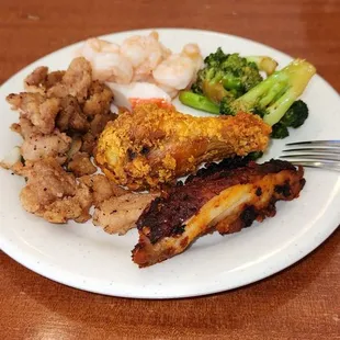 Pepper Chicken, Butter Shrimp, Steamed Broccoli, BBQ Chicken, And Fried Chicken.