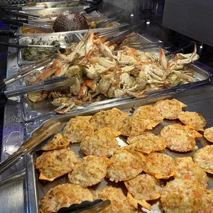 a variety of seafoods being prepared