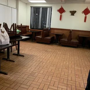 Inside booths 1 tables are staked due to COVID