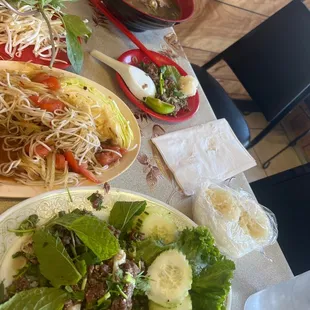 Raw beef larb, beef pho, papaya salad