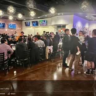 a group of people in a restaurant