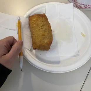 Egg roll, drenched in oil inside and out
