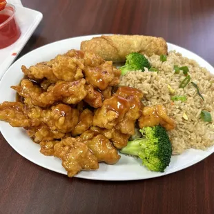 a plate of chicken, rice, and broccoli