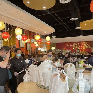 a large group of people in a restaurant