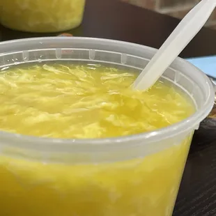 a bowl of soup with a spoon in it