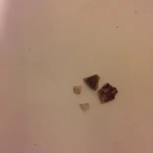 Pieces of shell or plate I got the pleasure of crunching into in my moo shu vegetable.