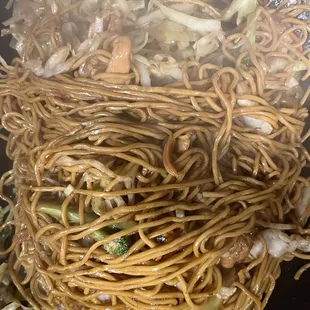 a stir fry with noodles and vegetables