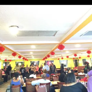 a large group of people sitting at tables