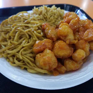 a plate of noodles and shrimp
