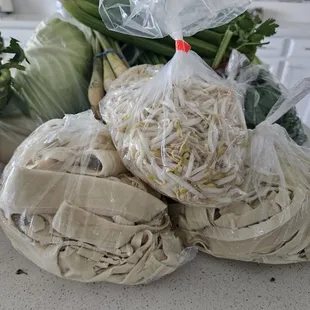 Bean sprouts $1 a bag and tofu strips $2 a bag