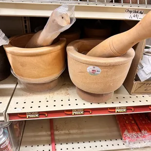 two wooden bowls and a wooden spoon