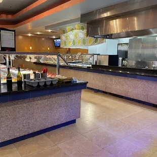 a woman standing in front of the buffet