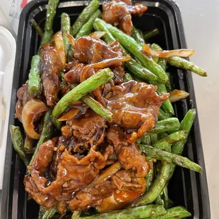 a tray of green beans and mushrooms