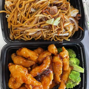 two take out containers of food