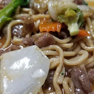 Beef and vegetables over fries noodles