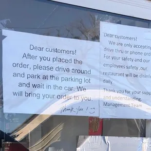 Sign on drive through window.
