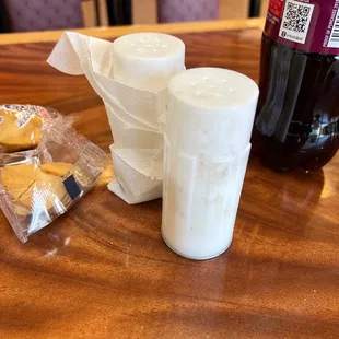 two salt and pepper shakers on a table