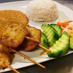 a plate of food with rice and vegetables