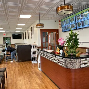 a restaurant with a large screen tv