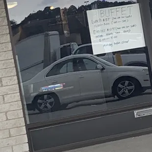 a car parked in front of a restaurant