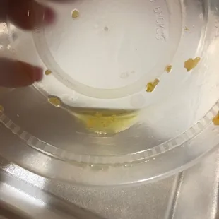 Oil at bottom of rice container ( some was already dumped)