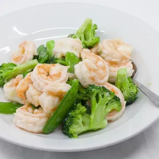 shrimp and broccoli on a white plate