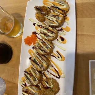 a plate of food and a glass of beer