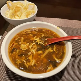 a bowl of soup and a bowl of fries