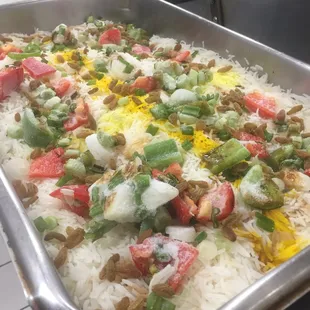 a pan of rice and vegetables