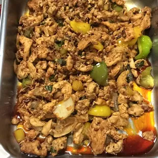 a person holding a tray of food