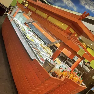 Cute boat filled with desserts.