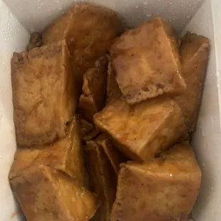 Shanghai tofu. Crispy outside, chewy inside. Sweet and tangy sauce (farther down in container.)