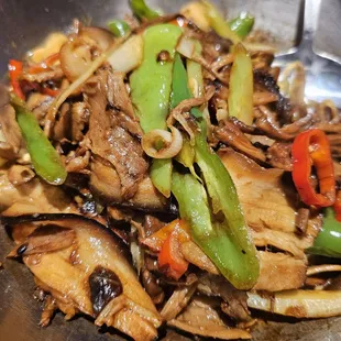 a stir fry with mushrooms and peppers