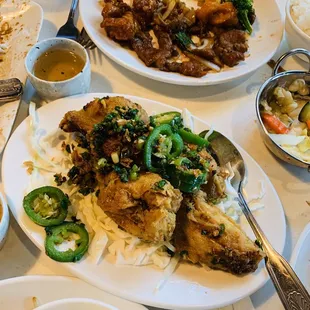 Salt and pepper fried chicken appetizer approx 6 meaty wings with jalapeños yummmyyyy