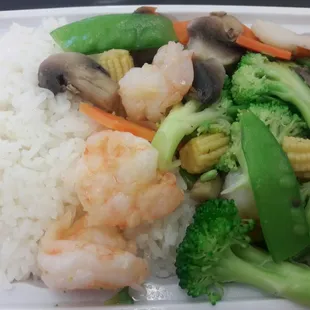 shrimp, broccoli, and rice in a styrofoam container