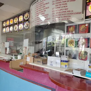 the counter and menus of the restaurant
