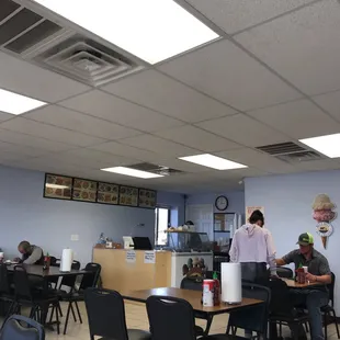 people eating at tables in a restaurant